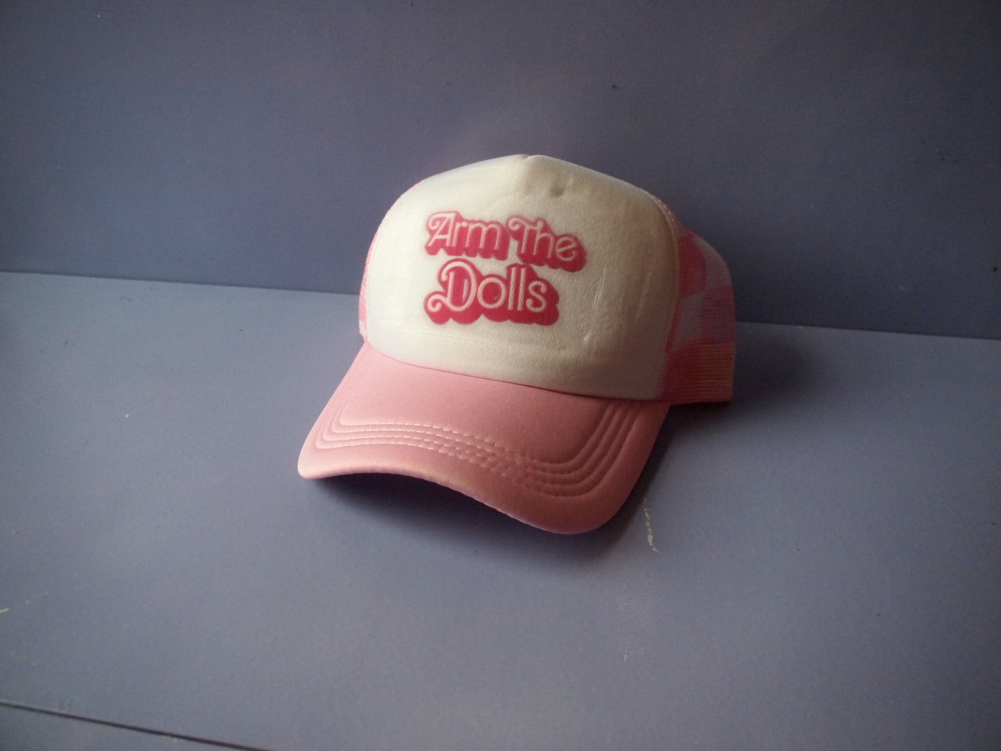 "Arm The Dolls" Pink Trucker Hat
