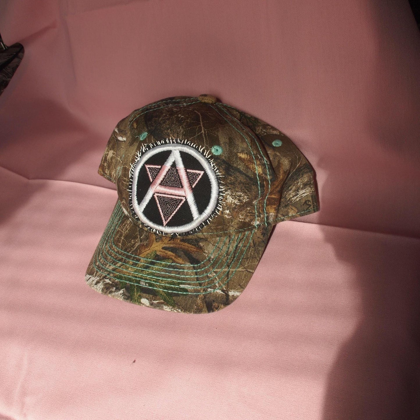 Queer Anarchism Embroidered Symbol Realtree Camo Patched Hat - Circle A Anarchist Symbol W/ Inverted Pink Triangle