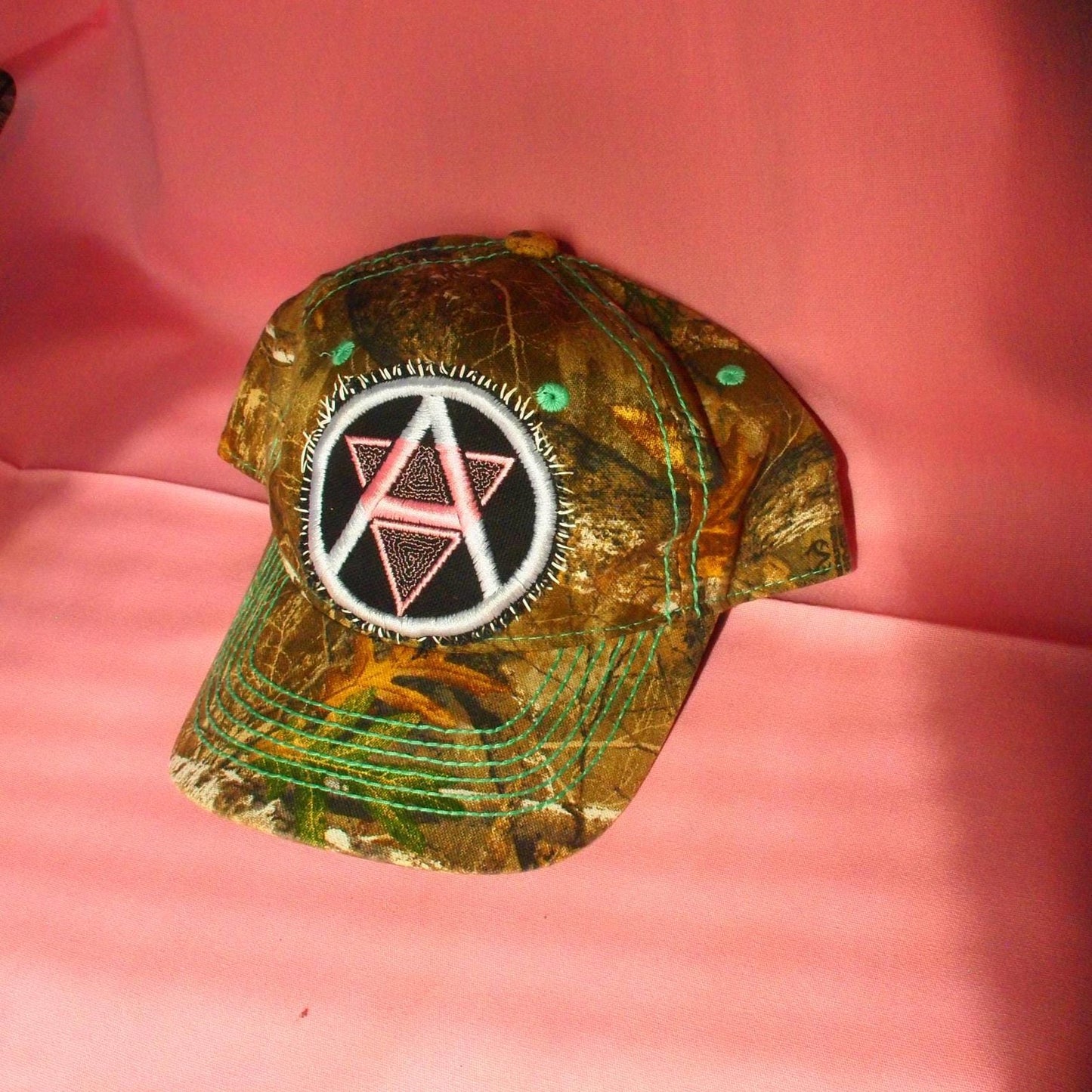 Queer Anarchism Embroidered Symbol Realtree Camo Patched Hat - Circle A Anarchist Symbol W/ Inverted Pink Triangle
